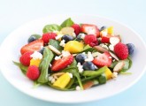spinach salad with fruit, almonds, and feta cheese