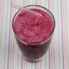 strawberry blueberry banana smoothie in glass