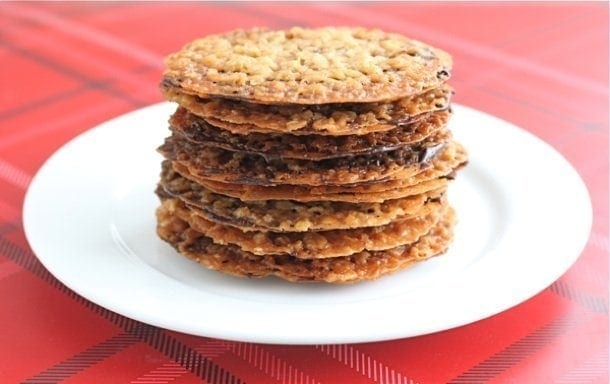 Lace Cookies are always a favorite Christmas Cookie. Everyone loves these thin and crispy oatmeal cookies filled with chocolate!