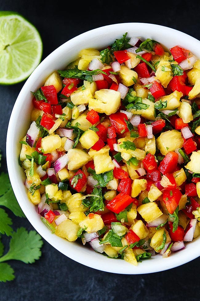 This fresh and simple Pineapple Salsa goes great with fish, chicken, tacos, or tortilla chips! #pineapple #salsa #summer #easyrecipe #glutenfree #vegan #vegetarian Pineapple Salsa in bowl.