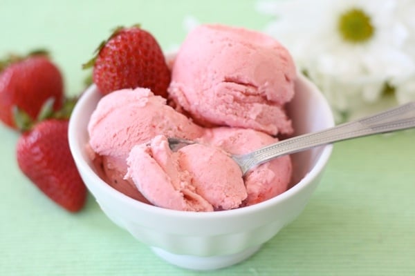 Strawberry Sour Cream Ice Cream in a bowl with a spoon