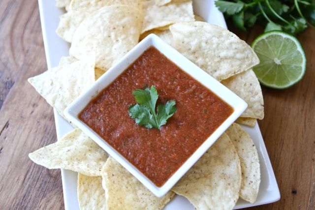 Plated chips and homemade salsa made from easy salsa recipe