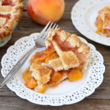 Peach pie slice on white plate