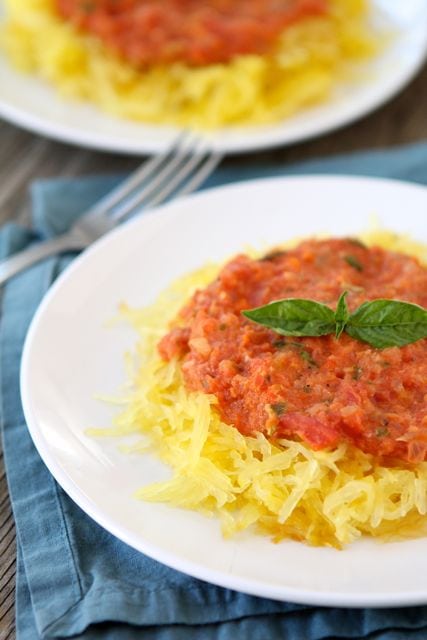 spaghetti squash with red pepper sauce on plates