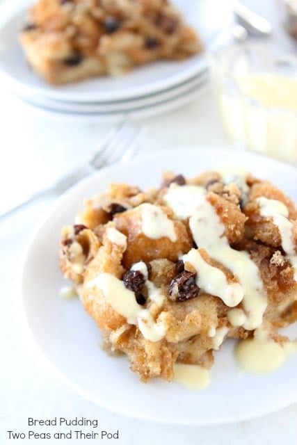 Bread pudding covered in vanilla custard sauce