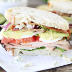 sliced cobb salad sandwich with eggs and bleu cheese