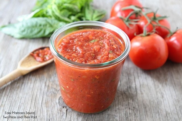 Best marinara sauce in glass dish with fresh basil