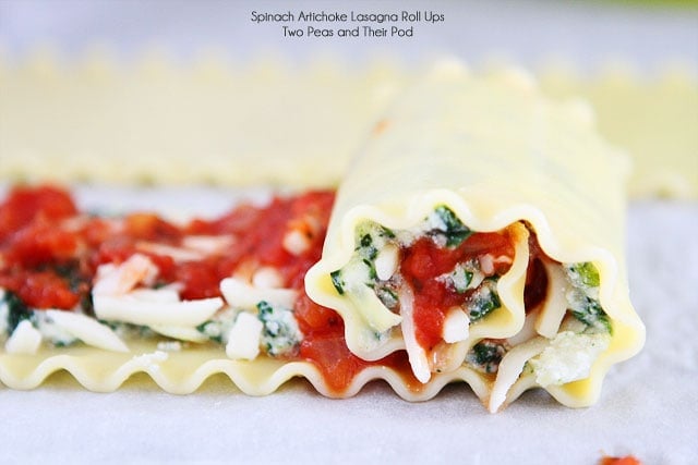 Easy Spinach Artichoke Lasagna Roll Ups on twopeasandtheirpod.com Fun to make and fun to eat! Easy Spinach Artichoke Lasagna Roll Ups