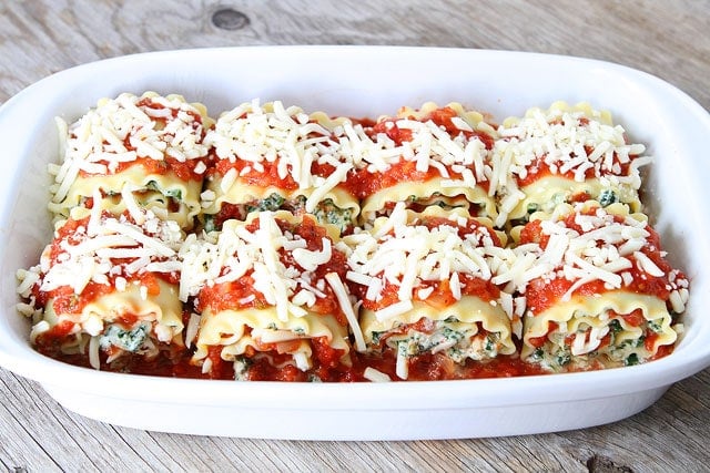 Easy Lasagna Roll Ups on twopeasandtheirpod.com Easy Lasagna Roll Ups in pan