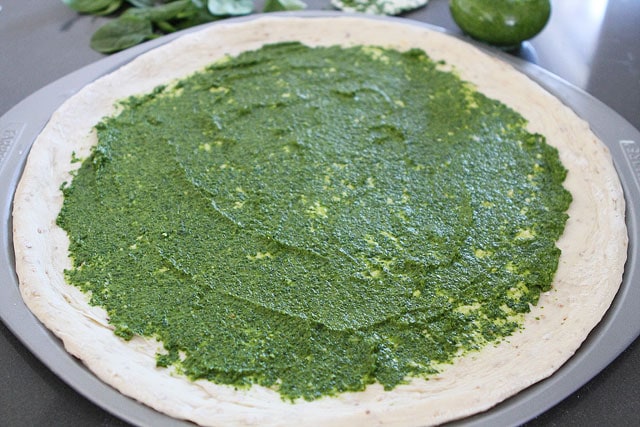 Spinach Artichoke Pesto Pizza Recipe on twopeasandtheirpod.com