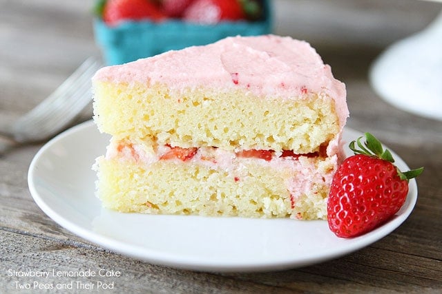 Strawberry Lemonade Cake Recipe on twopeasandtheirpod.com Tart lemon cake with fresh strawberries and strawberry buttercream!