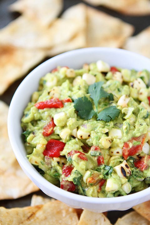Roasted Corn & Red Pepper Guacamole Recipe on twopeasandtheirpod.com The perfect guacamole for summer!