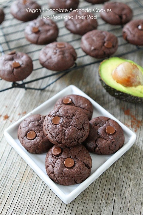 Vegan Chocolate Cookie Recipe on twopeasandtheirpod.com Vegan Cookies with double the chocolate piled on plate