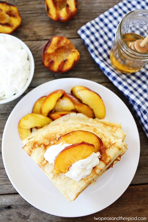 Crepes with Grilled Peaches & Cream Recipe on twopeasandtheirpod.com Perfect summer dessert or breakfast!