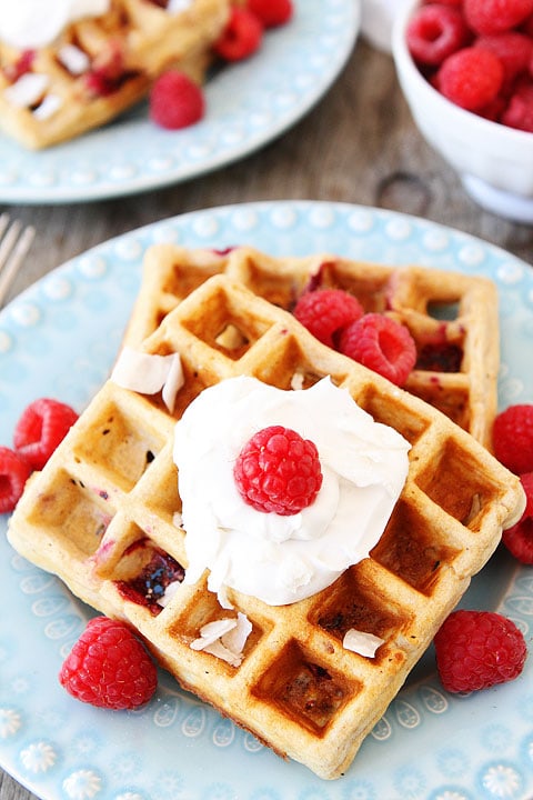 Coconut Raspberry Waffles with Coconut Whipped Cream Recipe on twopeasandtheirpod.com Our favorite waffles!