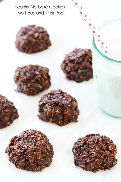 Gluten free no bake cookies set out to cool with glass of milk