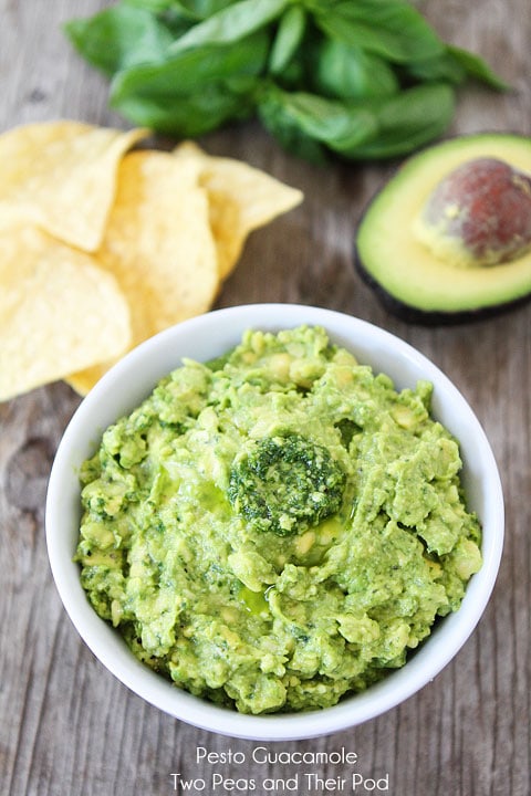 Pesto Guacamole Recipe on twopeasandtheirpod.com Perfect for parties or snacking!