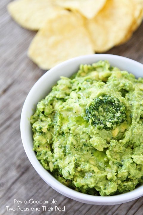 Easy Pesto Guacamole Recipe on twopeasandtheirpod.com