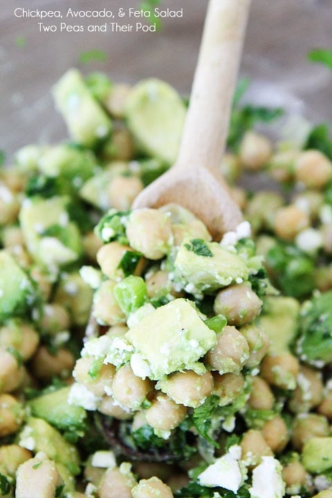 Chickpea, Avocado, & Feta Salad  on wood spoon. 