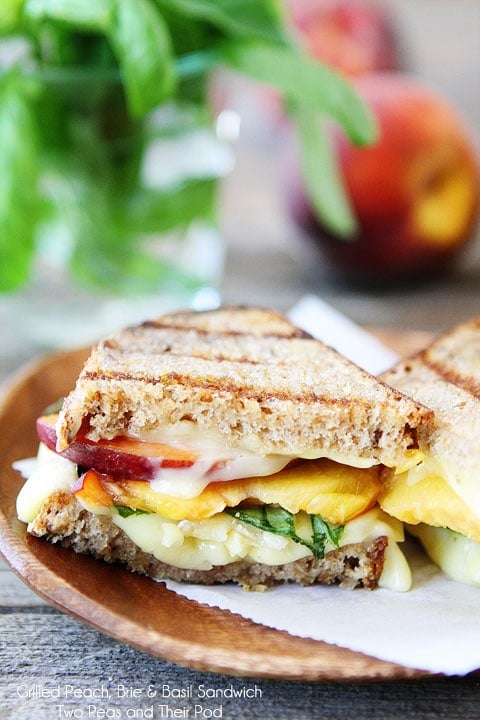 Grilled Peach, Brie, & Basil Sandwich with a drizzle of honey on twopeasandtheirpod.com 