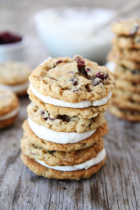 Oatmeal Cranberry Sandwich Cookies with White Chocolate Creme Filling on twopeasandtheirpod.com The perfect holiday cookie!