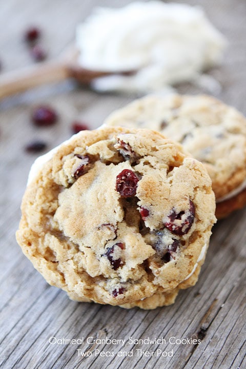 Oatmeal Cranberry Sandwich Cookies with White Chocolate Creme Filling on twopeasandtheirpod.com