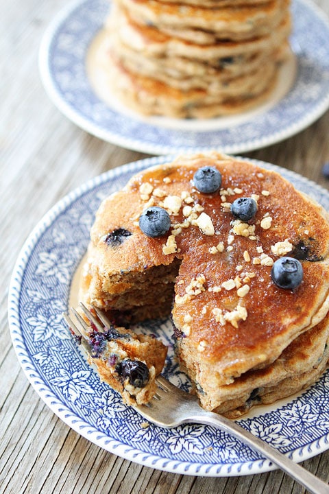 Whole Wheat Blueberry Granola Pancakes on twopeasandtheirpod.com #healthy #recipe