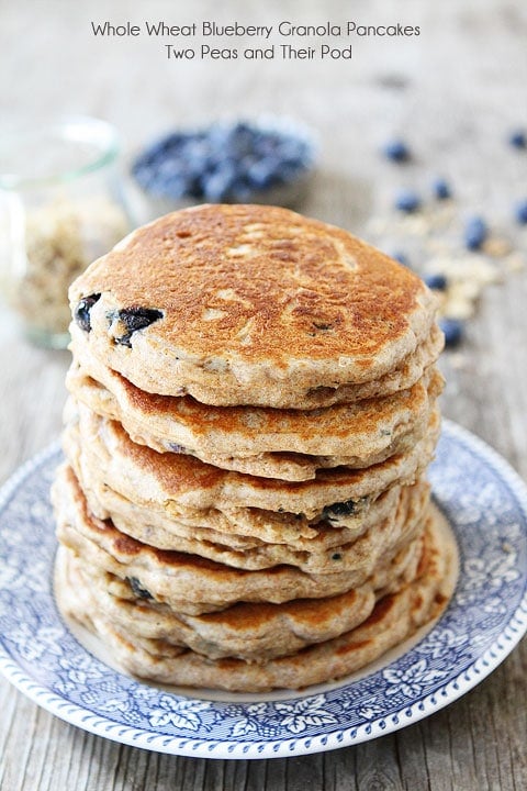 Recipe for Whole Wheat Blueberry Granola Pancakes on twopeasandtheirpod.com I want a big stack of these pancakes!