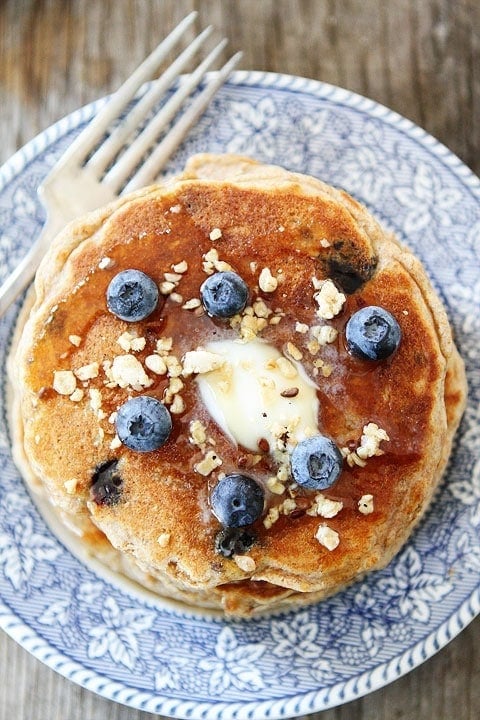 Whole Wheat Blueberry Granola Pancakes on twopeasandtheirpod.com The perfect breakfast!