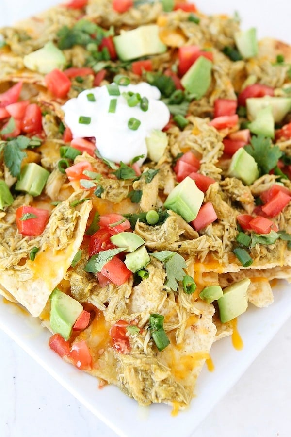 Chicken Chile Verde Nachos Recipe on twopeasandtheirpod.com Perfect for game day! 