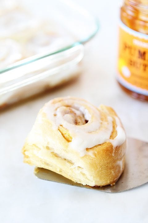 Easy Mini Pumpkin Cinnamon Rolls with Cream Cheese Frosting on twopeasandtheirpod.com 