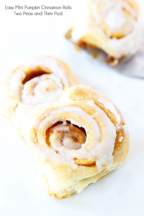 Easy Mini Pumpkin Cinnamon Rolls Recipe on twopeasandtheirpod.com These cinnamon rolls take less than 30 minutes to make!