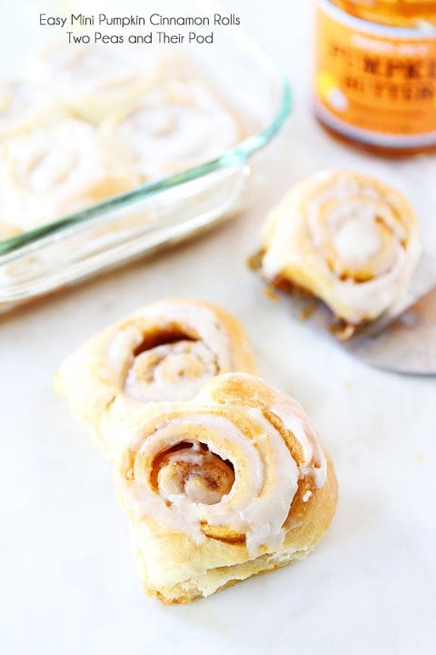 Easy Mini Pumpkin Cinnamon Rolls with Cream Cheese Frosting on twopeasandtheirpod.com Delicious cinnamon rolls that take less than 30 minutes to make!