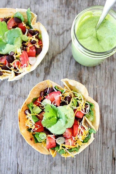 Taco Salad served in Homemade Tortilla Bowls! Recipe on twopeasandtheirpod.com