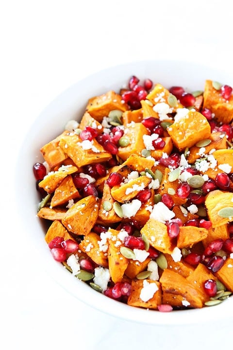 Roasted Sweet Potato Pomegranate Salad Recipe on twopeasandtheripod.com. This healthy salad is the perfect holiday side dish!