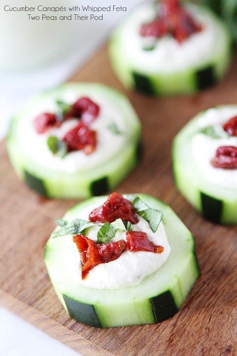 Cucumber Canapés with Whipped Feta, Sun-Dried Tomatoes and Basil on twopeasandtheirpod.com An easy appetizer for the holidays!