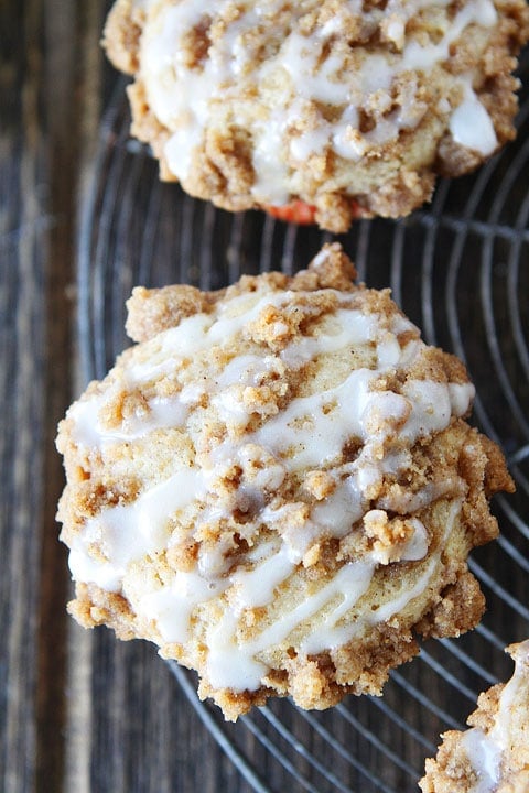 Eggnog Coffee Cake Muffins Recipe on twopeasandtheirpod.com Love the streusel and eggnog glaze!