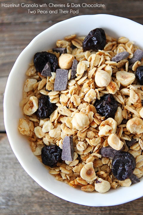 Hazelnut Granola with Dried Cherries and Dark Chocolate Recipe on twopeasandtheirpod.com Great for breakfast, snack time, or dessert!