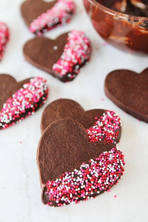 Chocolate Shortbread Heart Cookies on twopeasandtheirpod.com Chocolate cookies dipped in chocolate? YES!