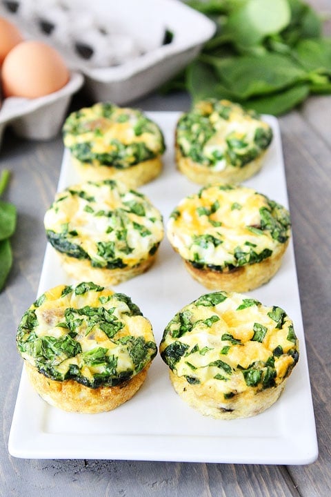 Egg Muffins with Sausage, Spinach, and Cheese Recipe on twopeasandtheirpod.com A fun and delicious breakfast!