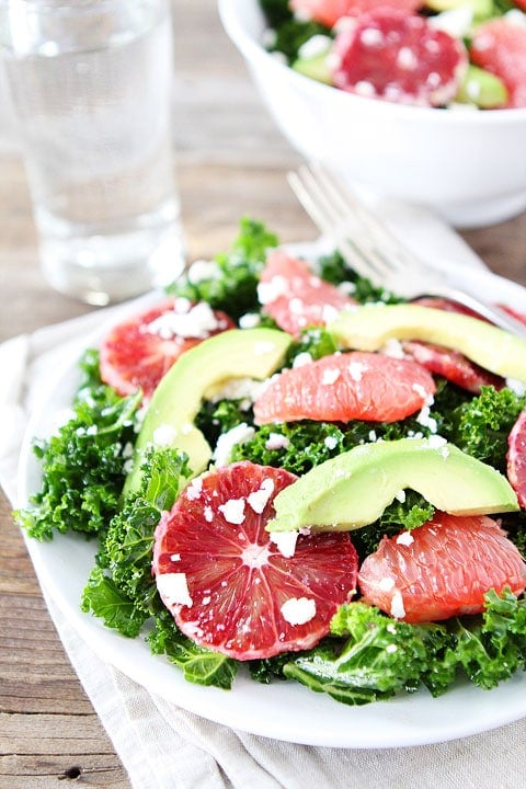 Healthy Kale Salad Recipe with Citrus, Avocado, and Feta on twopeasandtheirpod.com