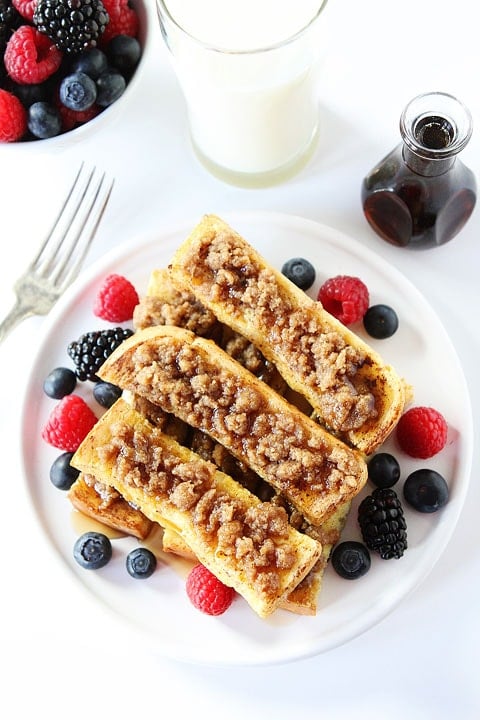 Homemade French Toast Sticks served with berries and maple syrup