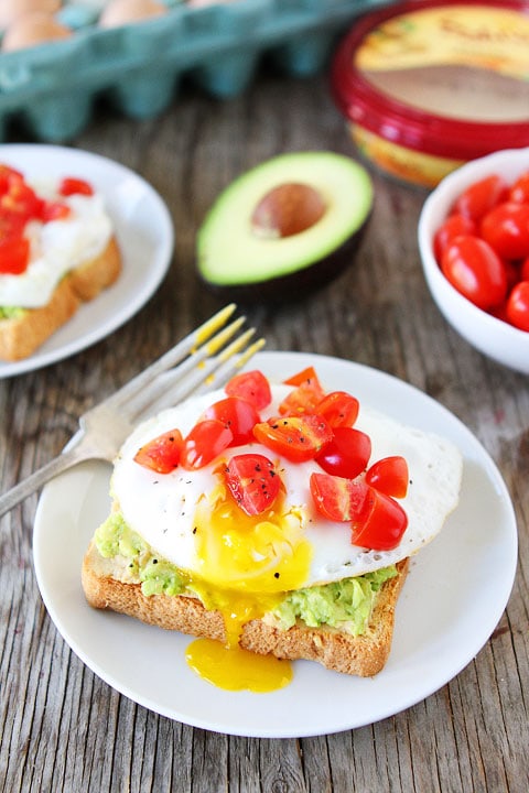 Avocado, Hummus, and Egg Toast Recipe on twopeasandtheirpod.com Love this easy and healthy recipe!