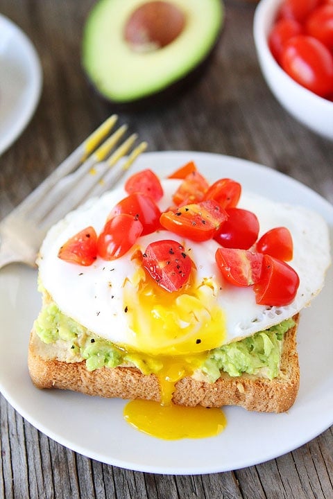 Avocado, Hummus, and Egg Toast Recipe on twopeasandtheirpod.com Great easy recipe for breakfast, snack time, or lunch!