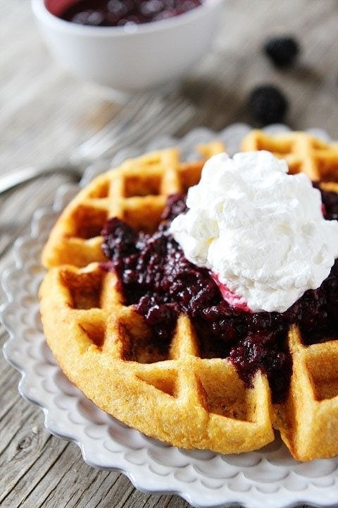 Cornmeal Waffles with Blackberry Compote Recipe on twopeasandtheirpod.com. Waffle perfection! These waffles are amazing!