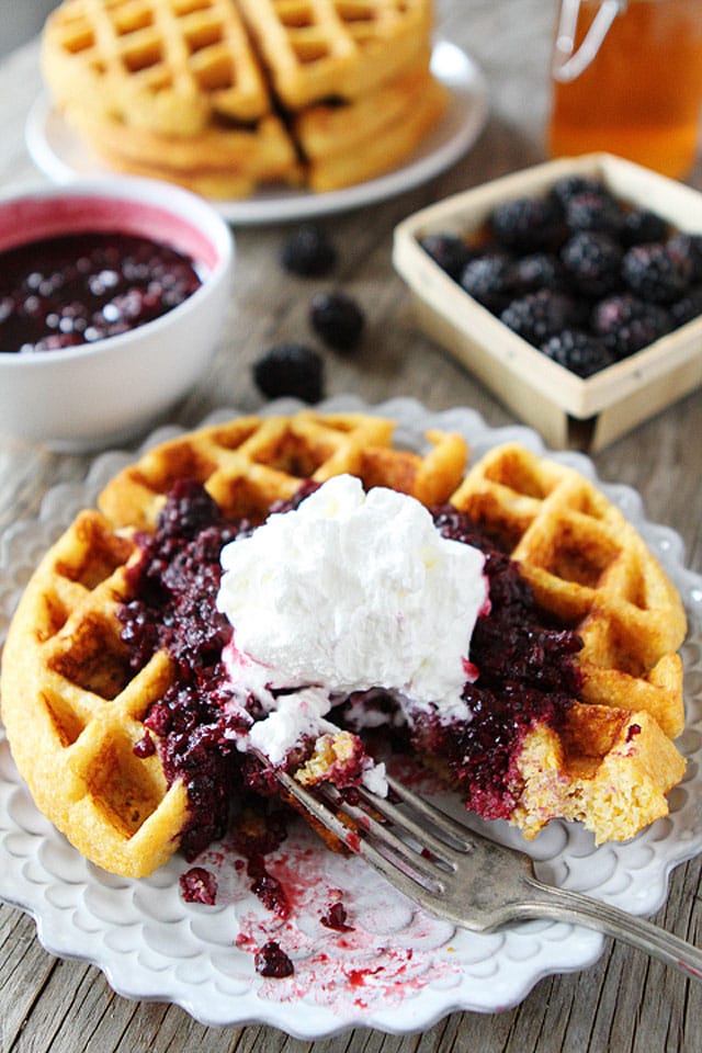 Cornmeal Waffles with Blackberry Compote Recipe on twopeasandtheirpod.com. Trust me, you NEED to make these waffles!