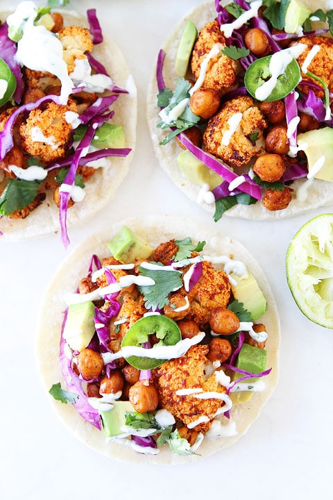 Easy roasted cauliflower tacos topped with cabbage, cilantro, and avocado
