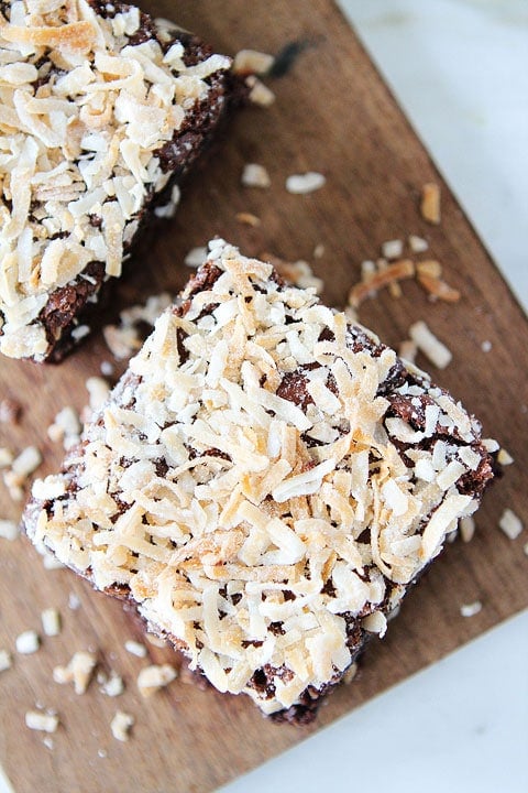 Coconut Brownie Recipe on twopeasandtheirpod.com. Fudgy brownies topped with coconut! Love these rich brownies!