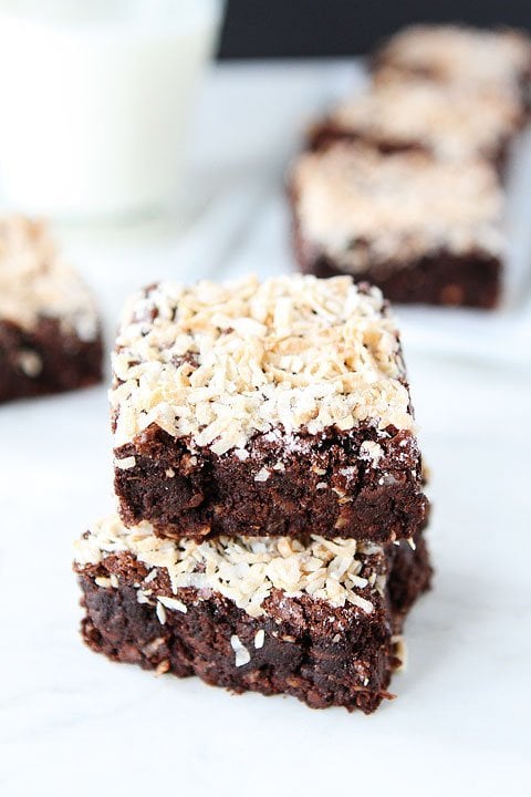 Coconut Brownie Recipe on twopeasandtheirpod.com. Fudgy brownies made with coconut oil and topped with shredded coconut! #brownies #coconut