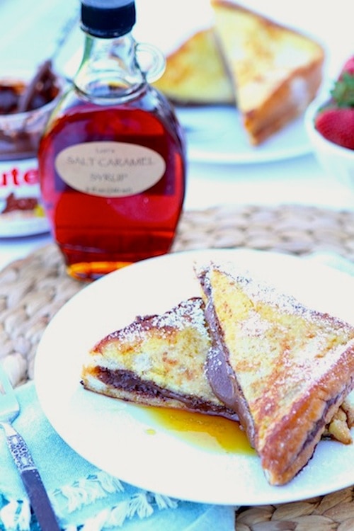 Nutella Stuffed French Toast Recipe on twopeasandtheirpod.com. This decadent French toast recipe is divine! A must make for special occasions!